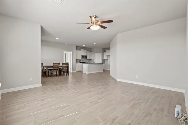 a view of a livingroom with a kitchen