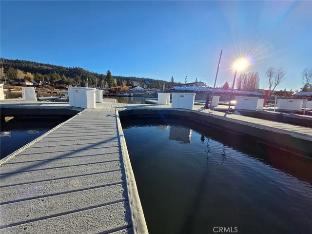 a view of a dining table with paintings on the wall