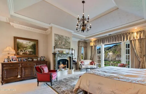 a bed room with furniture and a fireplace