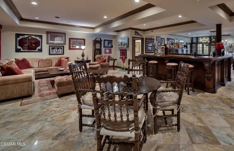 a living room with lots of furniture and lots of furniture