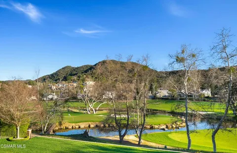 a view of an ocean with a building in the background