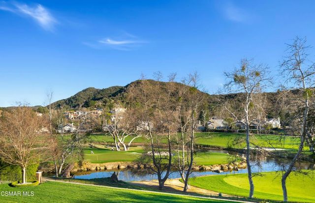a view of an ocean with a building in the background