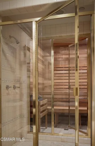 a bathroom with a glass door shower