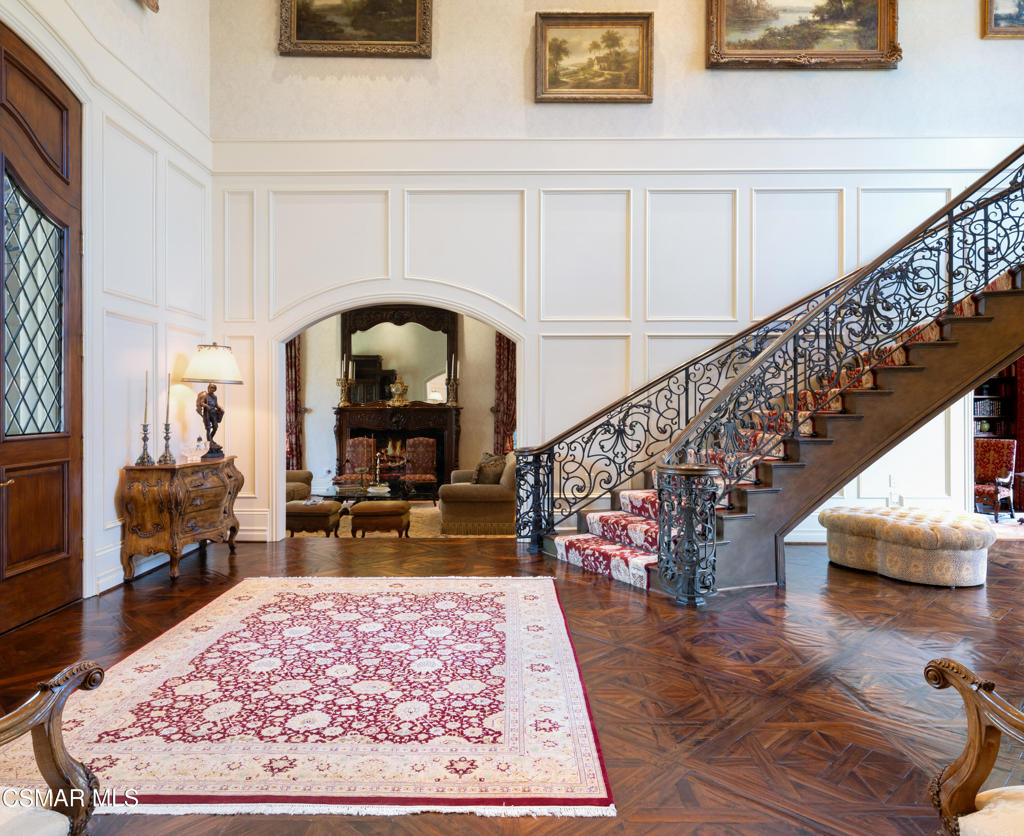 240 West Stafford Road Thousand Oaks, CA 91361 - Photo 5 of 26 a living room with stairs and a table