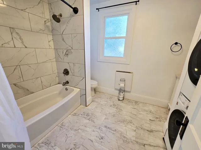 a bathroom with a sink a bathtub and a shower