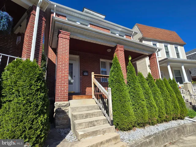 front view of a house with a small yard