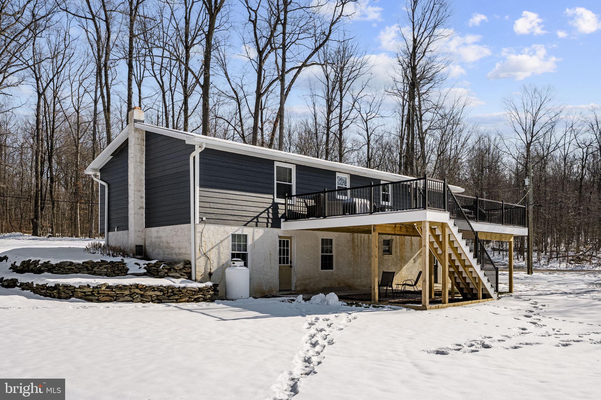 108 Red Well Road New Holland, PA 17557 - Photo 11 of 59 a view of a house with snow on the road