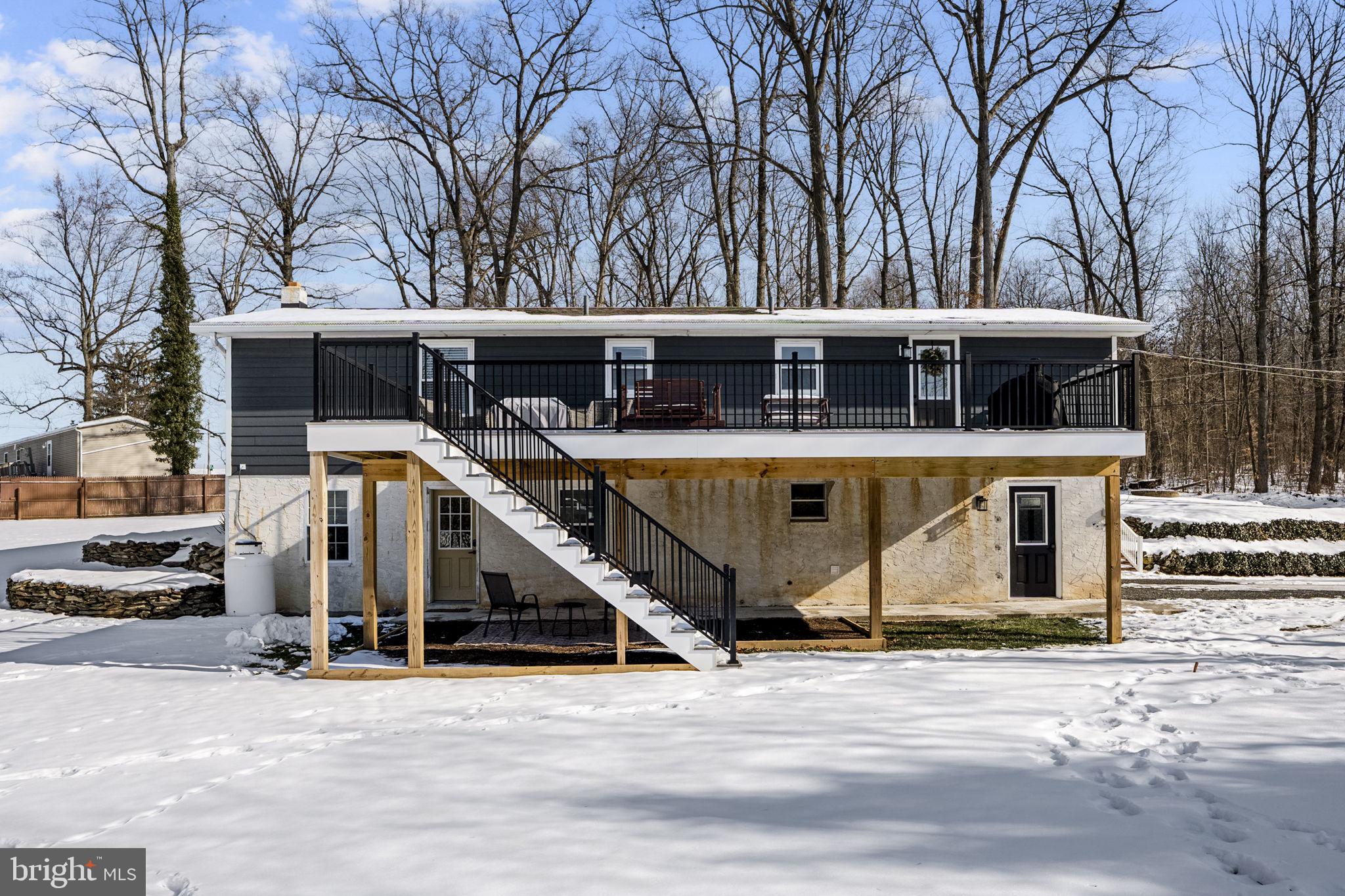 108 Red Well Road New Holland, PA 17557 - Photo 12 of 59 a view of a house with a yard and large trees