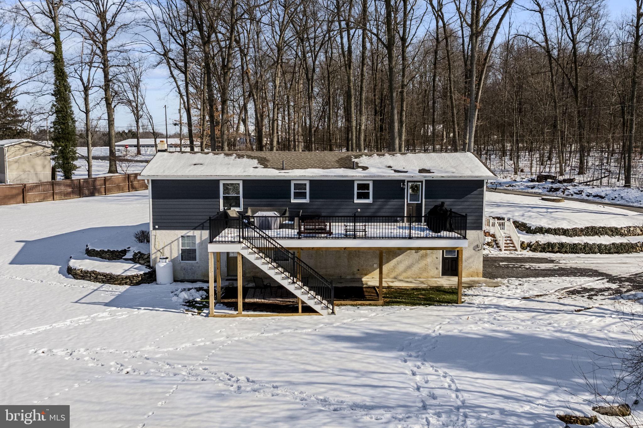 108 Red Well Road New Holland, PA 17557 - Photo 13 of 59 a view of a swimming pool with outdoor seating and plants
