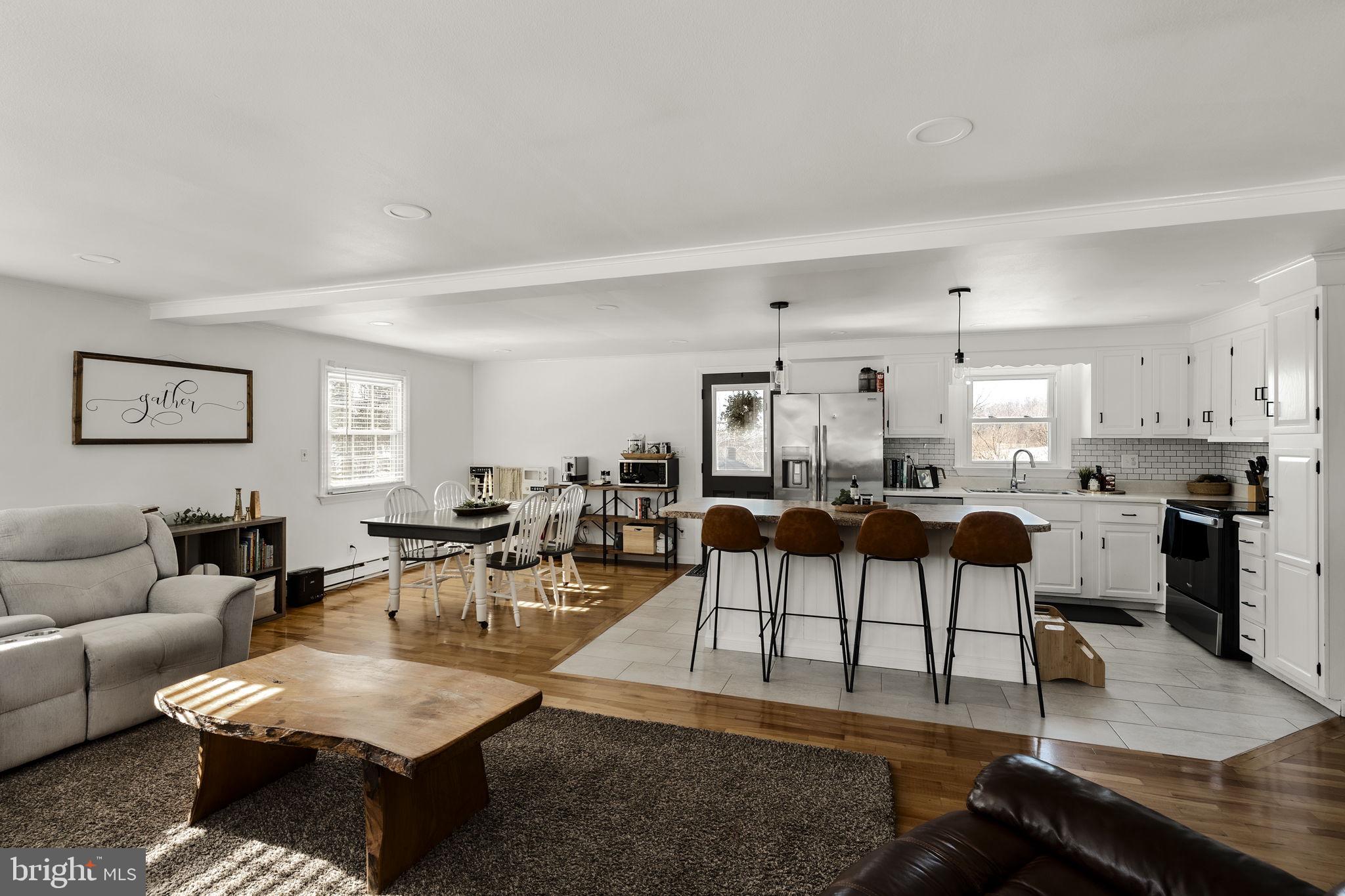 108 Red Well Road New Holland, PA 17557 - Photo 25 of 59 a living room with lots of furniture and kitchen view