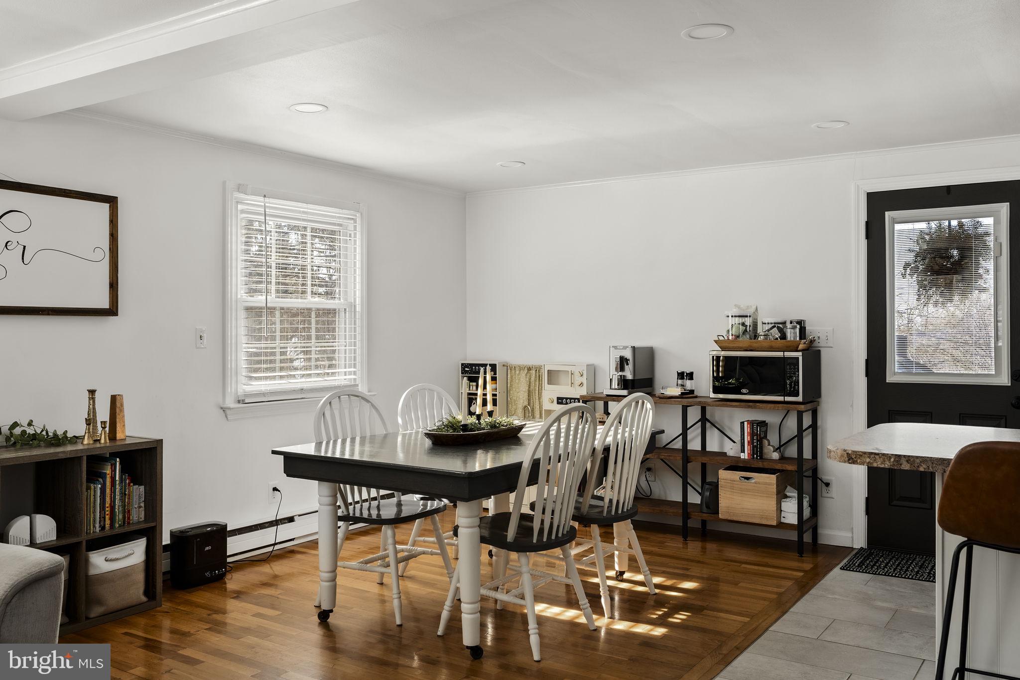108 Red Well Road New Holland, PA 17557 - Photo 26 of 59 a view of a dining room with furniture and wooden floor
