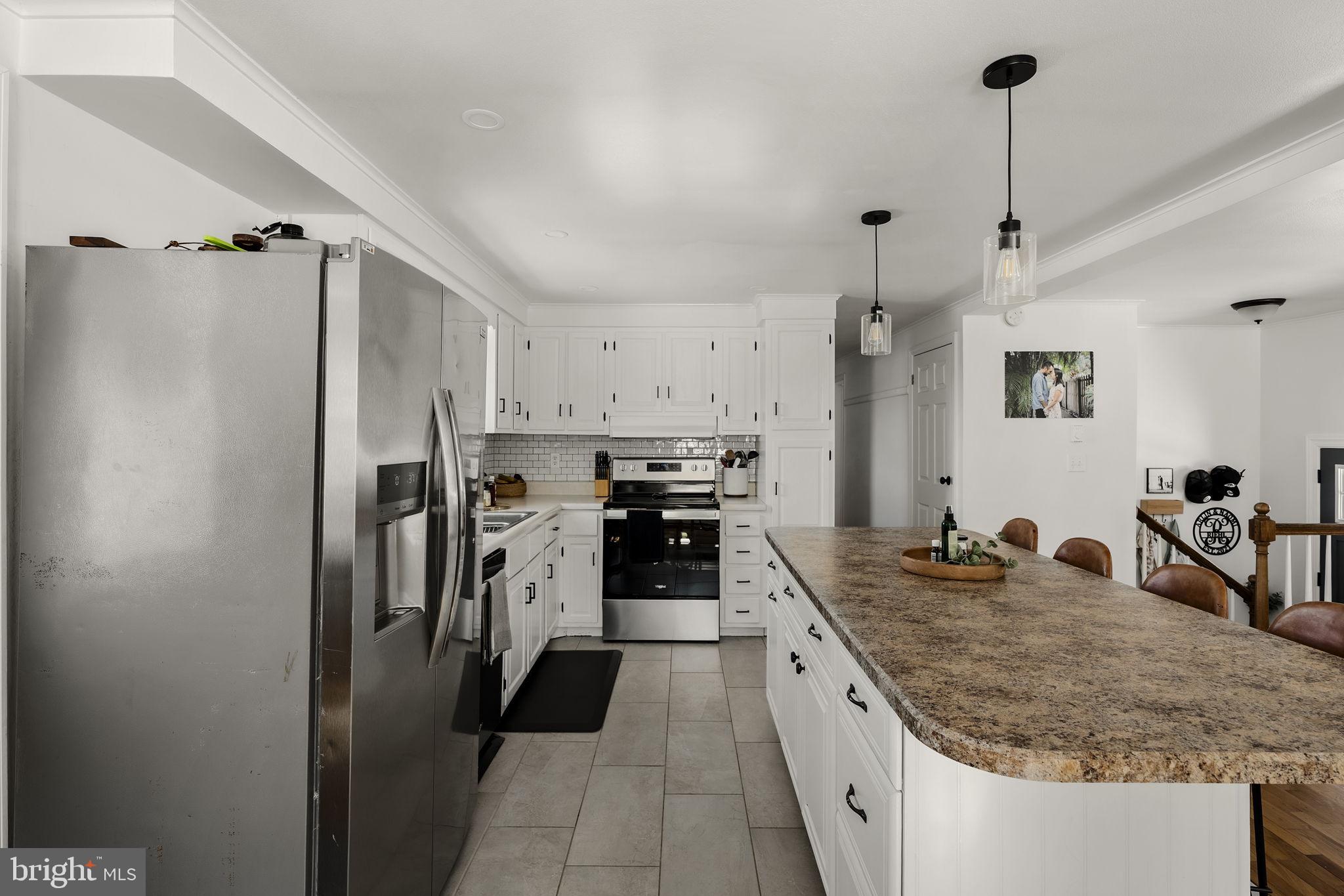 108 Red Well Road New Holland, PA 17557 - Photo 29 of 59 a large kitchen with a stove a refrigerator a sink and dishwasher