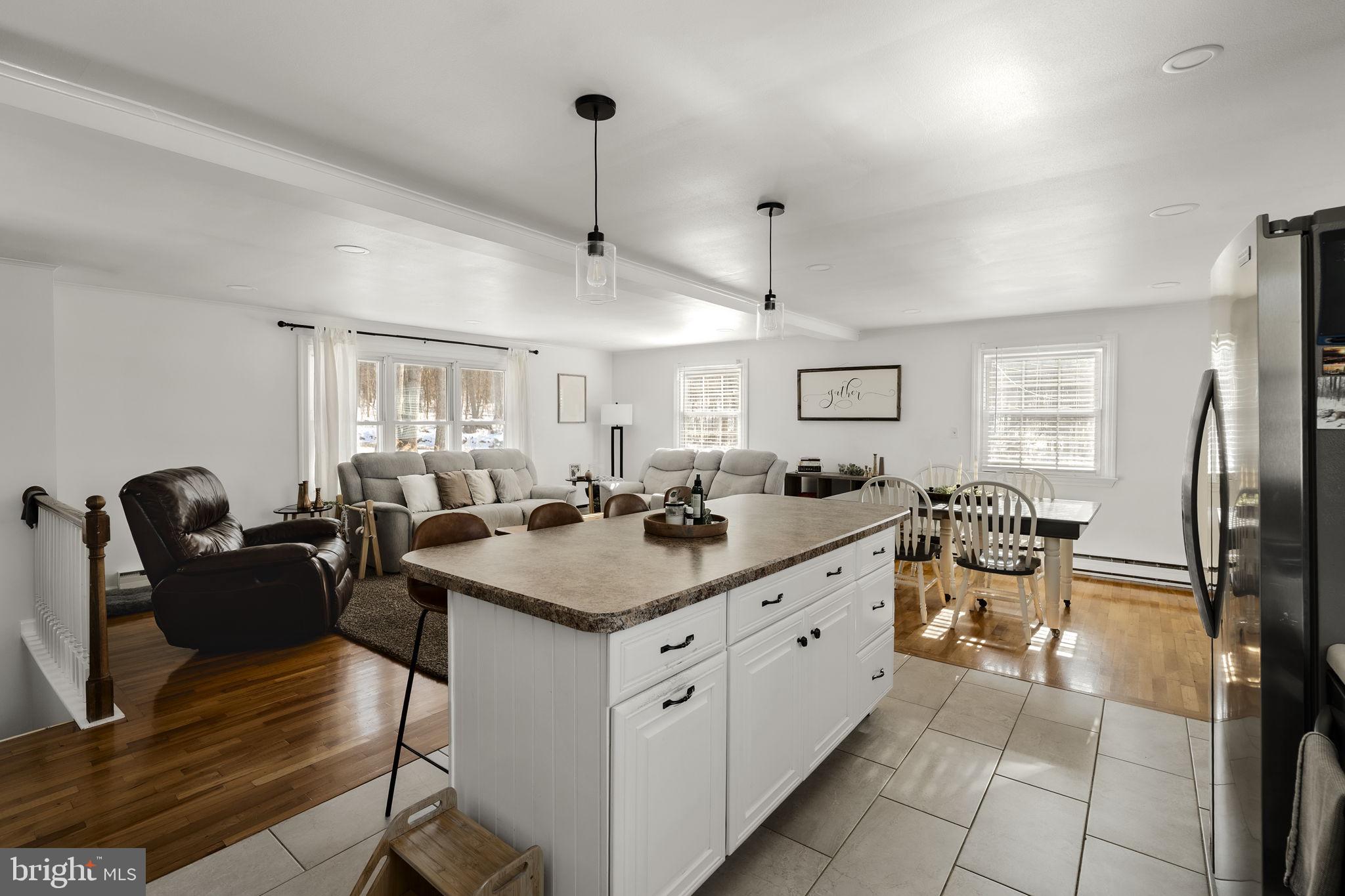108 Red Well Road New Holland, PA 17557 - Photo 32 of 59 a kitchen with a stove a refrigerator and a dining table