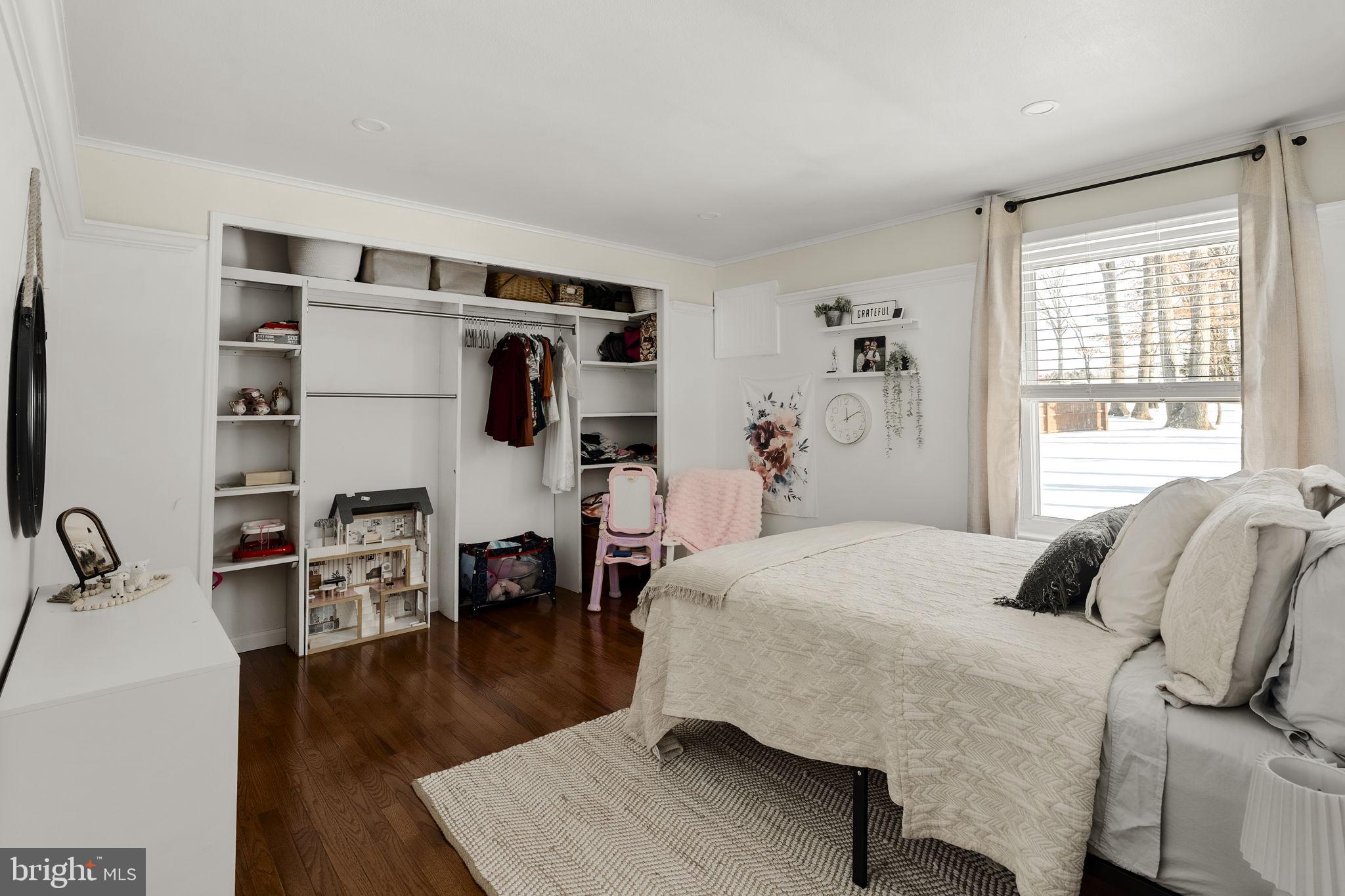 108 Red Well Road New Holland, PA 17557 - Photo 35 of 59 a bedroom with a bed and wooden floor