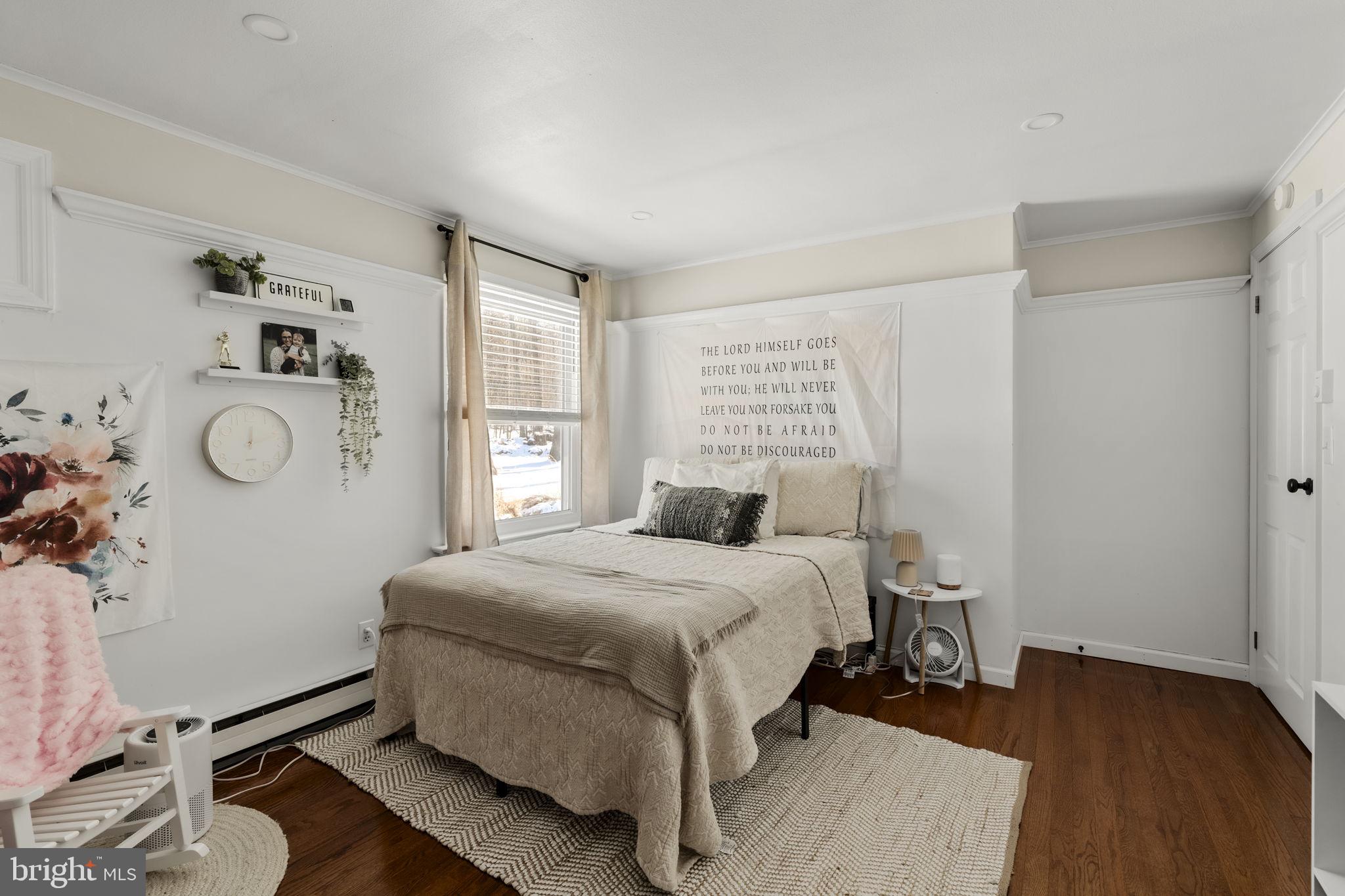 108 Red Well Road New Holland, PA 17557 - Photo 36 of 59 a bedroom with a bed and wooden floor