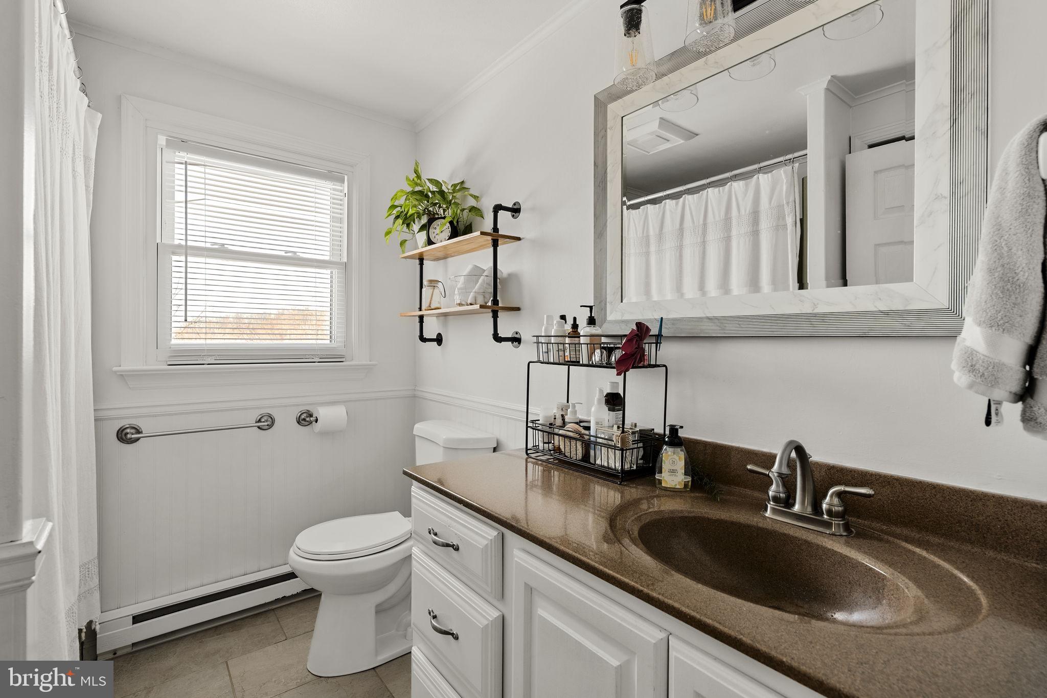 108 Red Well Road New Holland, PA 17557 - Photo 39 of 59 a bathroom with a toilet sink and mirror