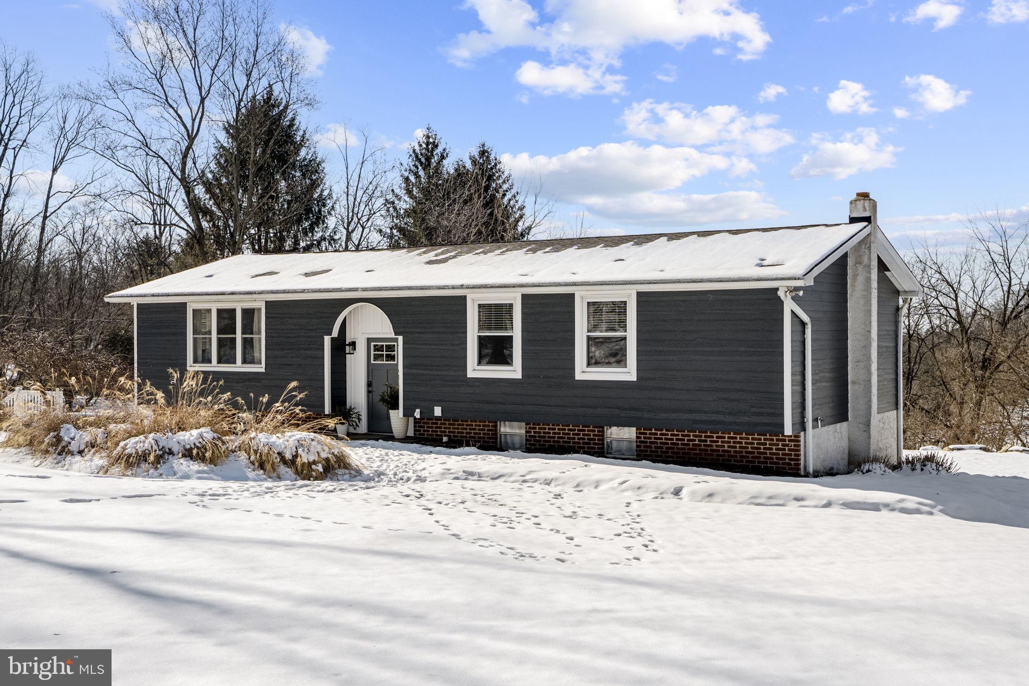 108 Red Well Road New Holland, PA 17557 - Photo 5 of 59 a front view of a house with a yard