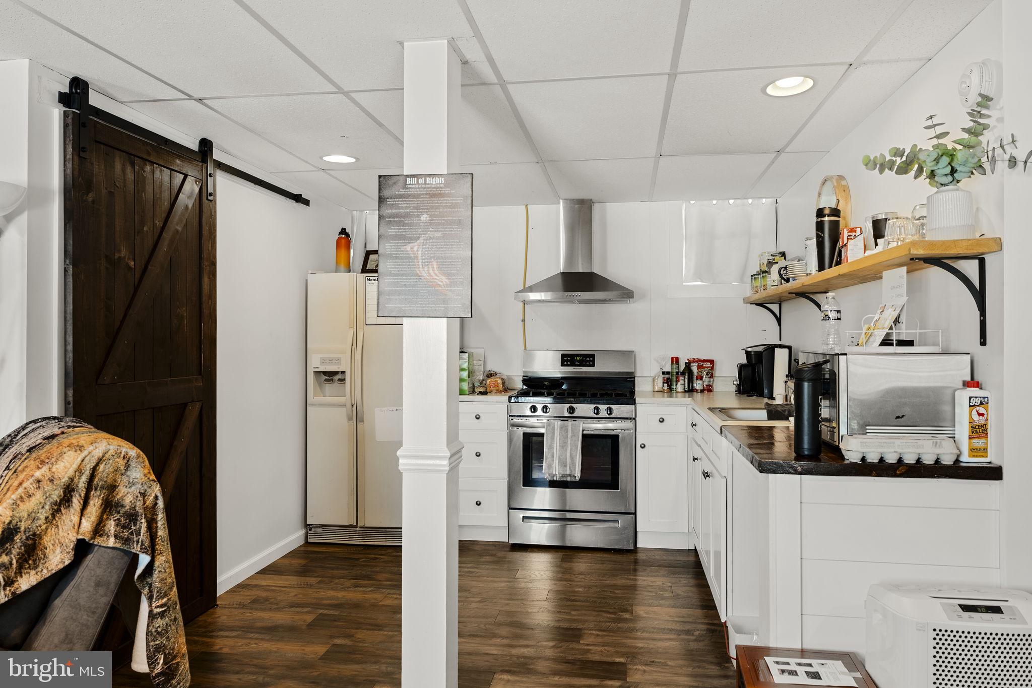 108 Red Well Road New Holland, PA 17557 - Photo 51 of 59 a kitchen with stainless steel appliances granite countertop a refrigerator and a stove