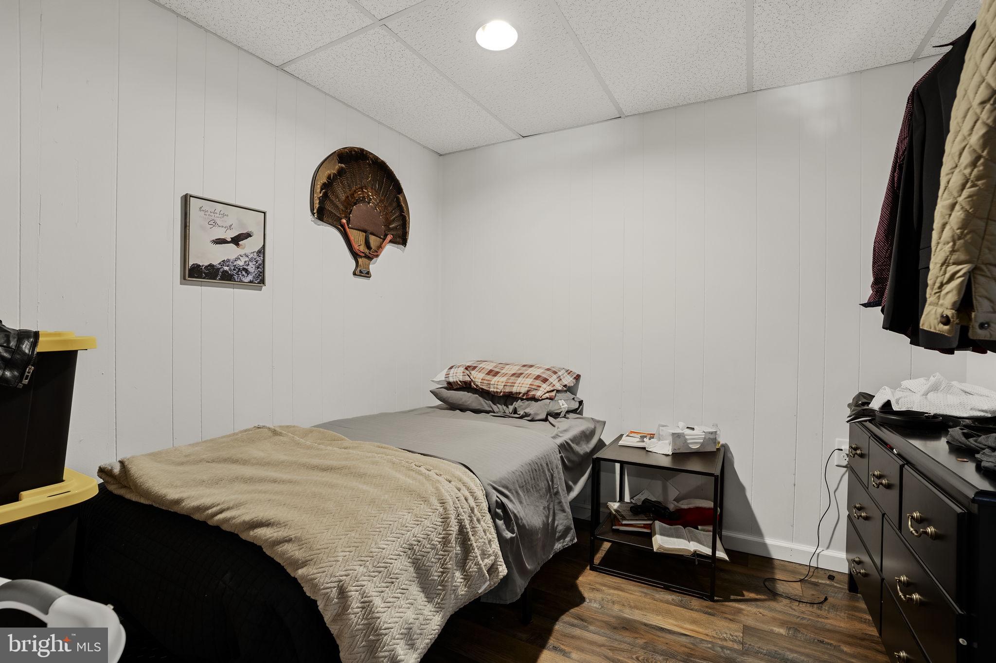 108 Red Well Road New Holland, PA 17557 - Photo 54 of 59 a bedroom with a bed and a flat tv screen on the dresser