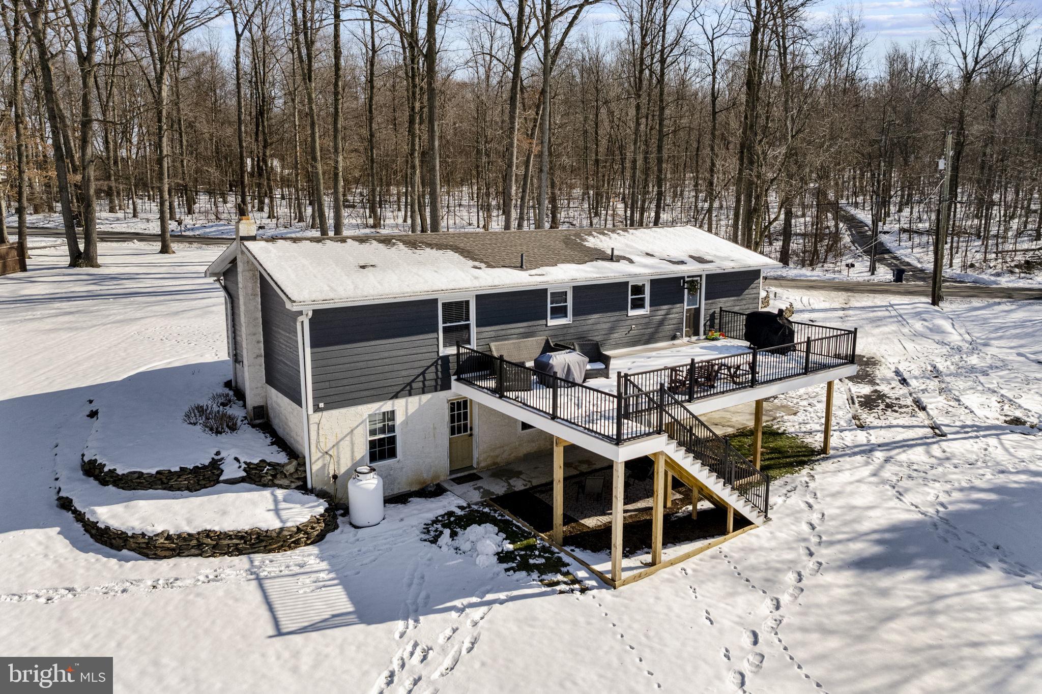 108 Red Well Road New Holland, PA 17557 - Photo 8 of 59 a view of a patio with table and chairs a barbeque
