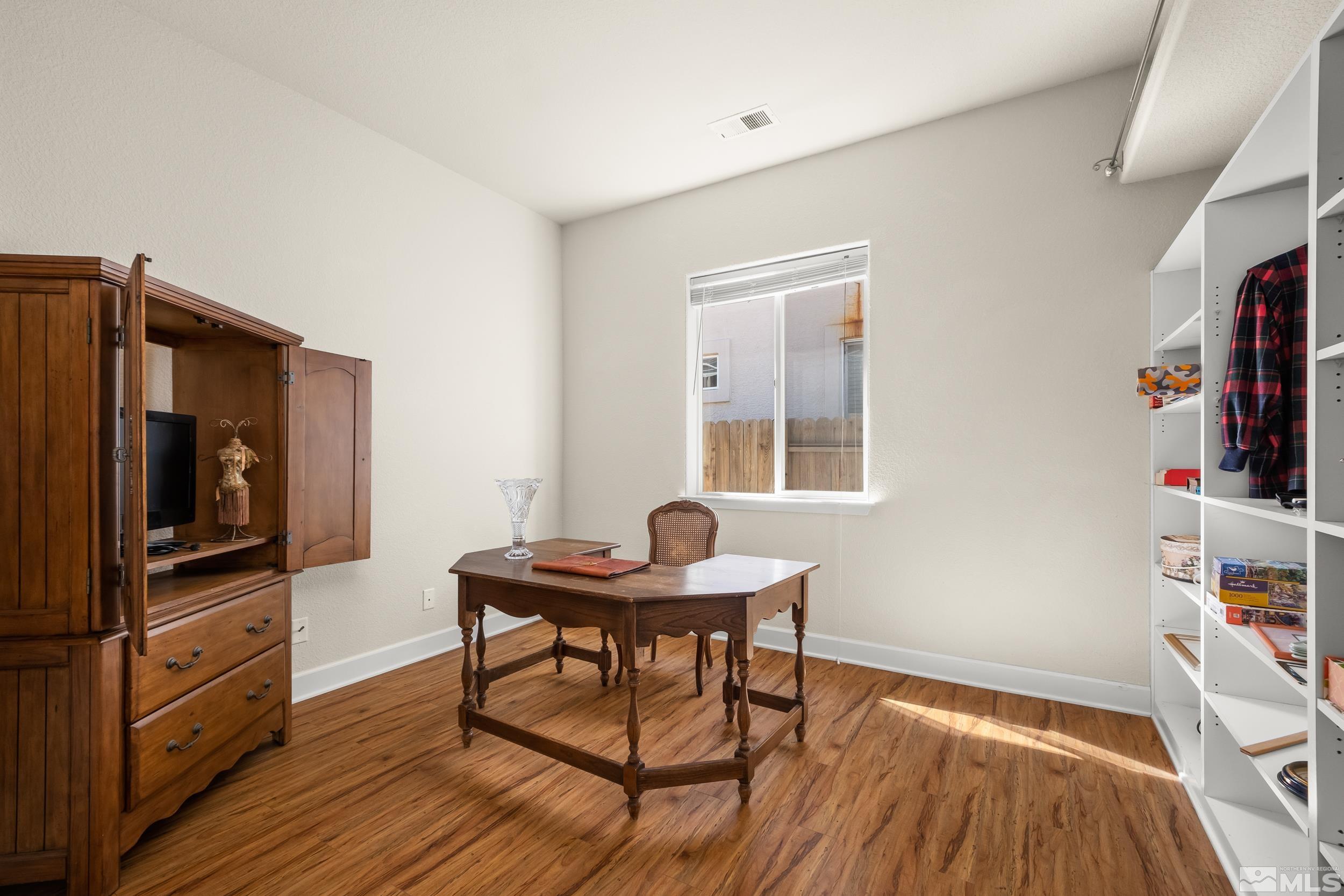 3463 Long Drive Minden, NV 89423 - Photo 15 of 40 a workspace with furniture and wooden floor