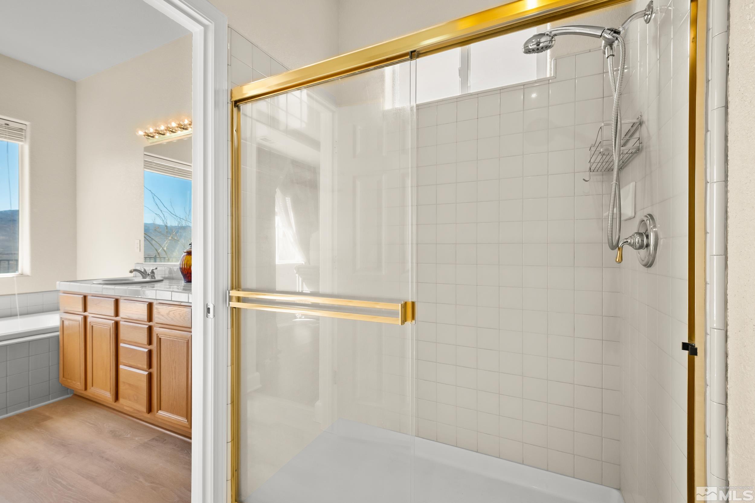 3463 Long Drive Minden, NV 89423 - Photo 23 of 40 a bathroom with a shower and a sink