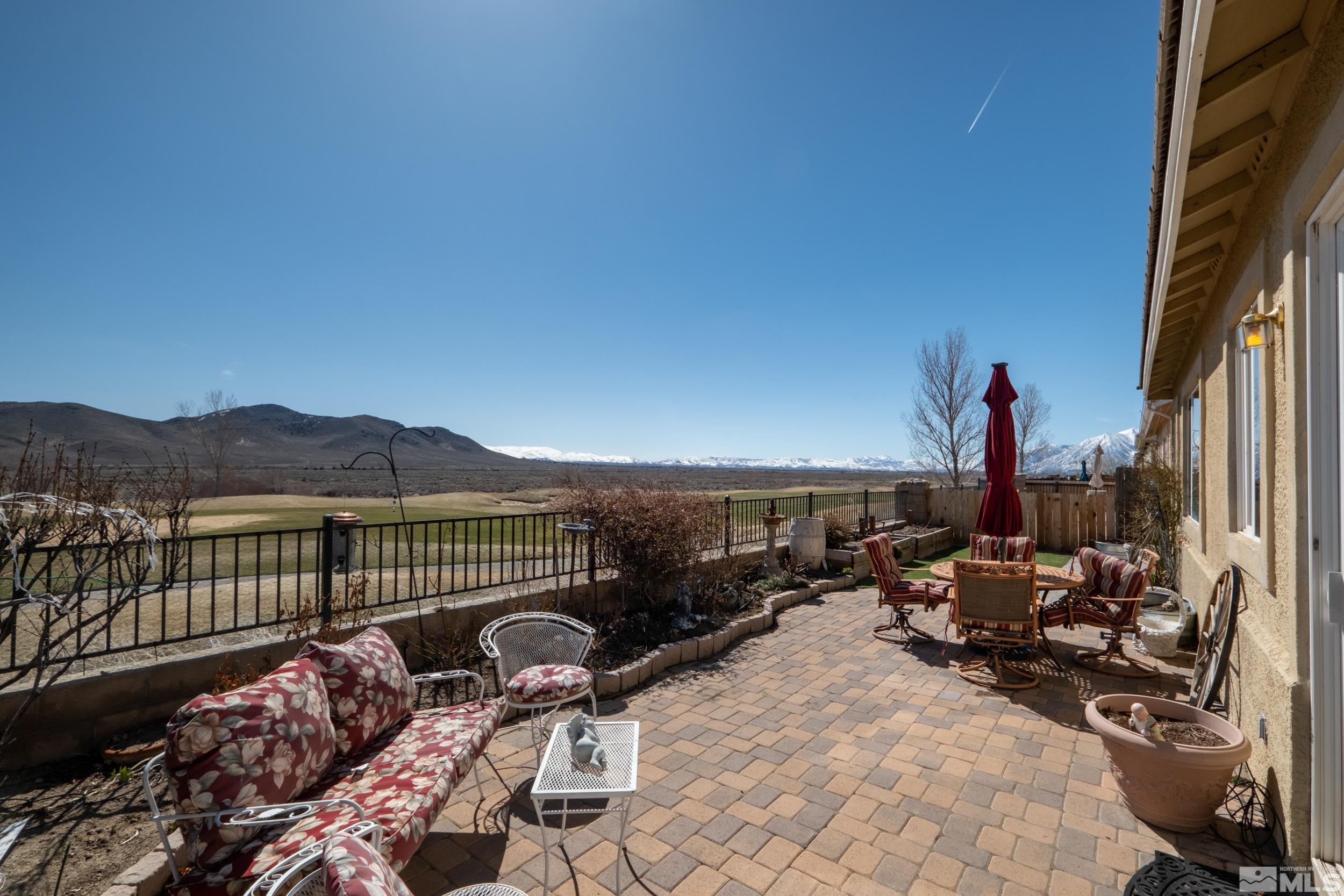 3463 Long Drive Minden, NV 89423 - Photo 24 of 40 a roof deck with table and chairs