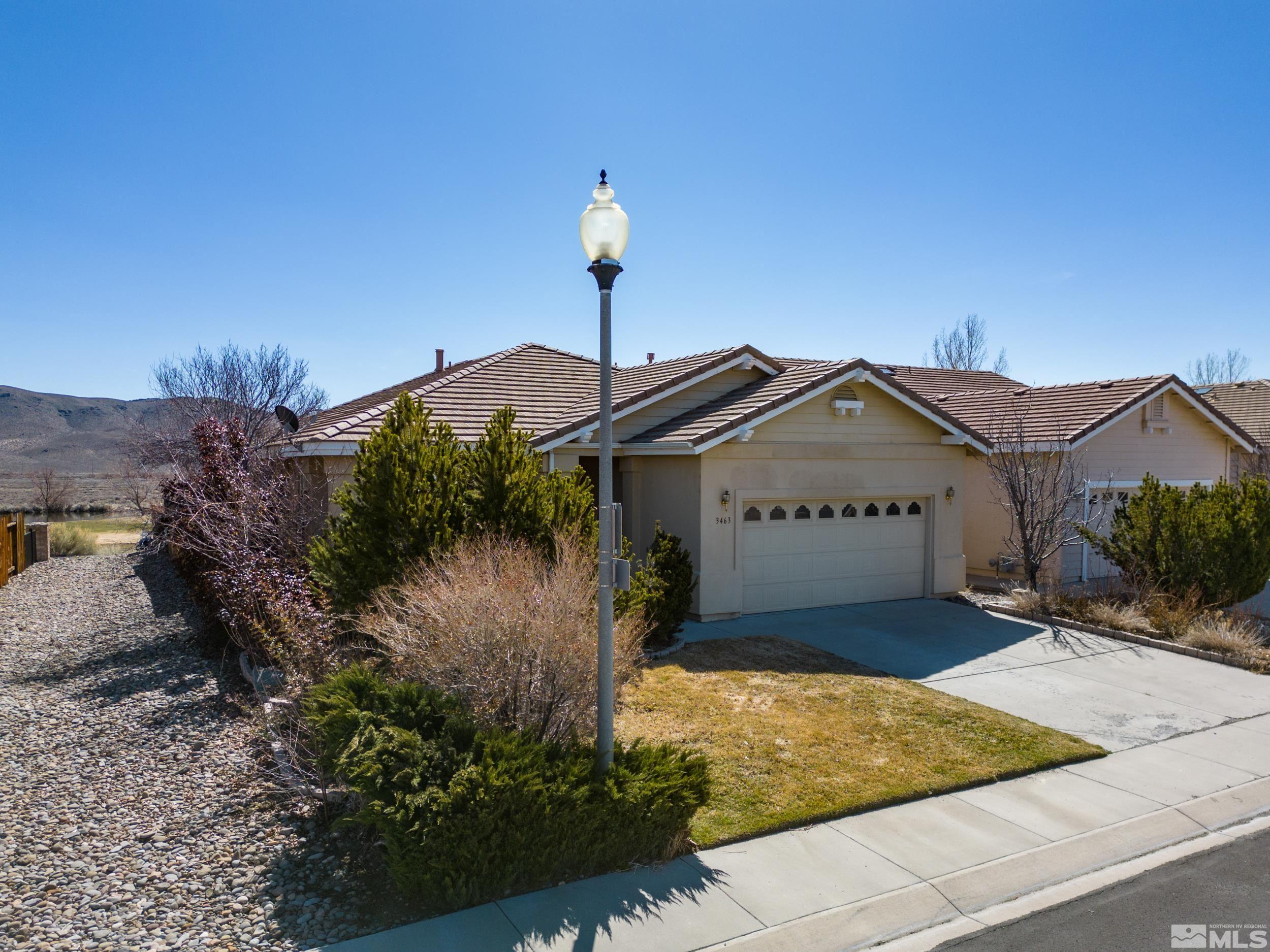 3463 Long Drive Minden, NV 89423 - Photo 3 of 40 a front view of a house with a yard