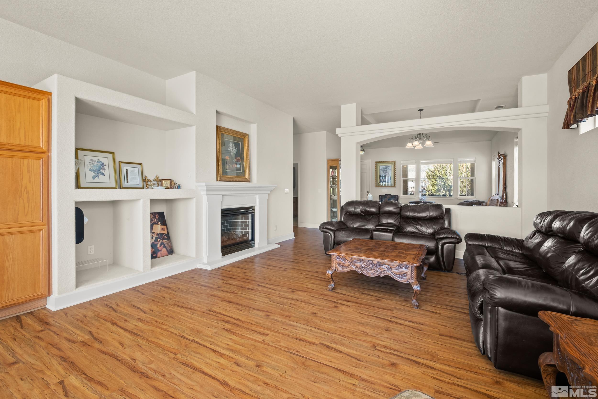 3463 Long Drive Minden, NV 89423 - Photo 9 of 40 a living room with furniture and a fireplace