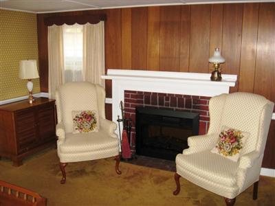10 Silverleaf Lane West Yarmouth, MA 02673 - Photo 7 of 12 a living room with furniture and a fireplace
