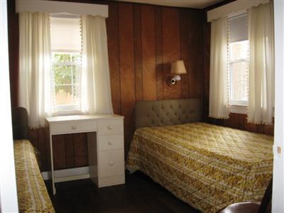 10 Silverleaf Lane West Yarmouth, MA 02673 - Photo 8 of 12 a bedroom with a bed and a window