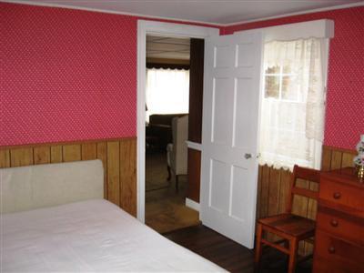 10 Silverleaf Lane West Yarmouth, MA 02673 - Photo 9 of 12 a bedroom with a bed and a dresser