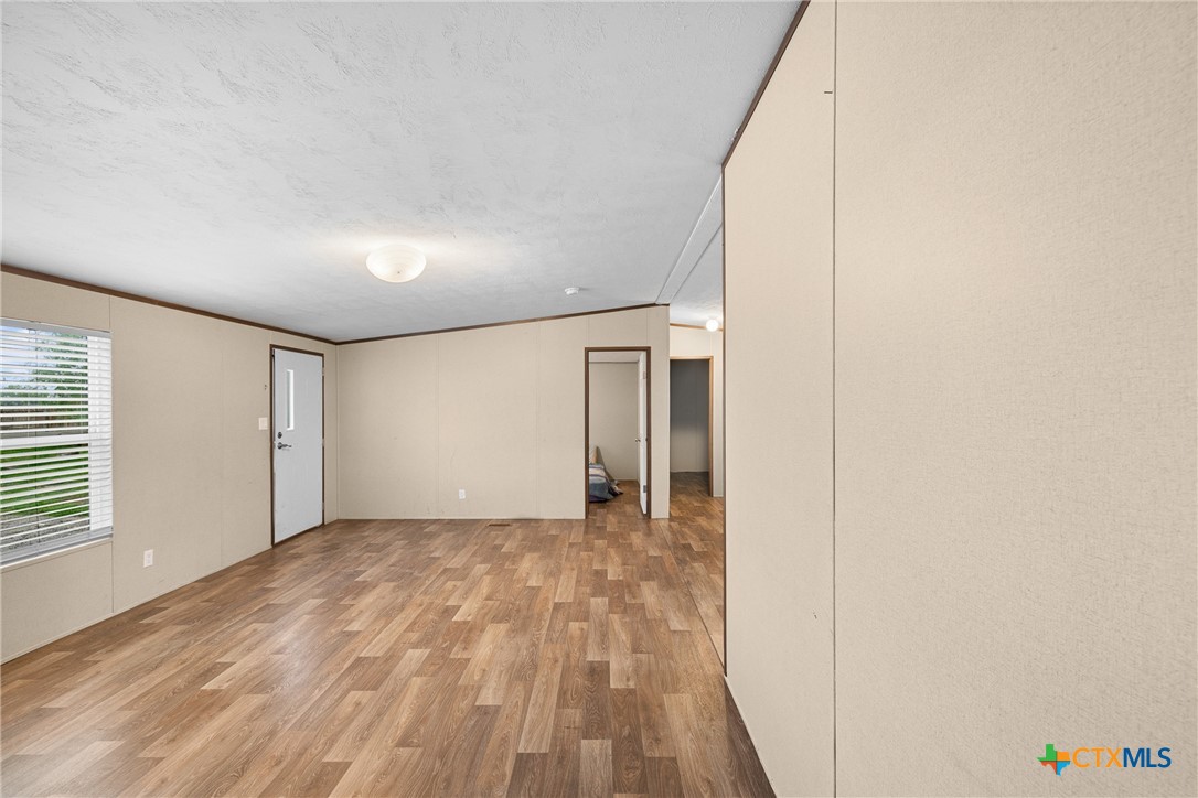 6497 Taylorsville Road Dale, TX 78616 - Photo 9 of 36 a view of empty room with wooden floor