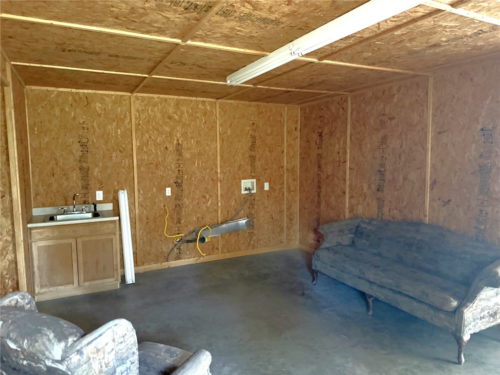 5878 East Boone Prairie Road, Unit COUNTYROAD Franklin, TX 77856 - Photo 14 of 42 a spacious bathroom with a granite countertop sink and a mirror