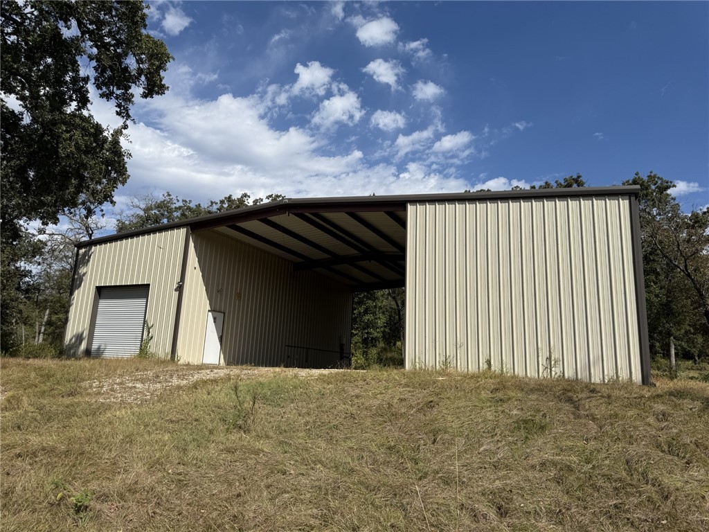 5878 East Boone Prairie Road, Unit COUNTYROAD Franklin, TX 77856 - Photo 2 of 42 a view of outdoor space and front view of a house