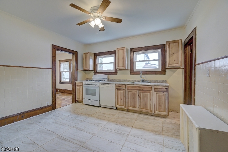 24 Brook Street Springfield, NJ 07081 - Photo 12 of 28 a kitchen with a cabinets window and stainless steel appliances