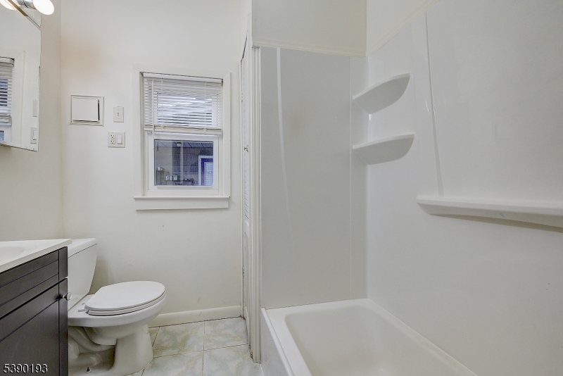 24 Brook Street Springfield, NJ 07081 - Photo 16 of 28 a bathroom with a toilet and a bathtub