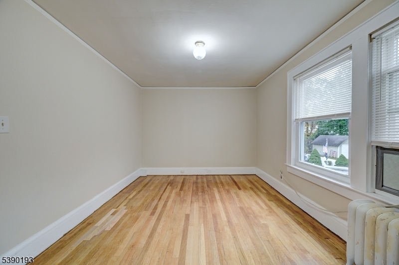 24 Brook Street Springfield, NJ 07081 - Photo 17 of 28 a view of a room with wooden floor and windows