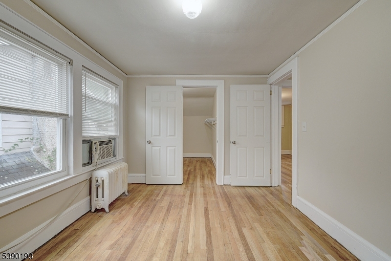24 Brook Street Springfield, NJ 07081 - Photo 18 of 28 a view of a room with wooden floor and windows