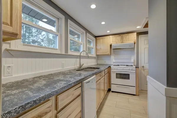 a kitchen with a stove and a sink