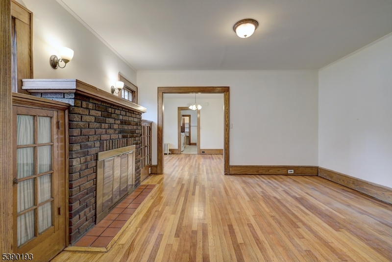 24 Brook Street Springfield, NJ 07081 - Photo 4 of 28 a view of a livingroom with wooden floor