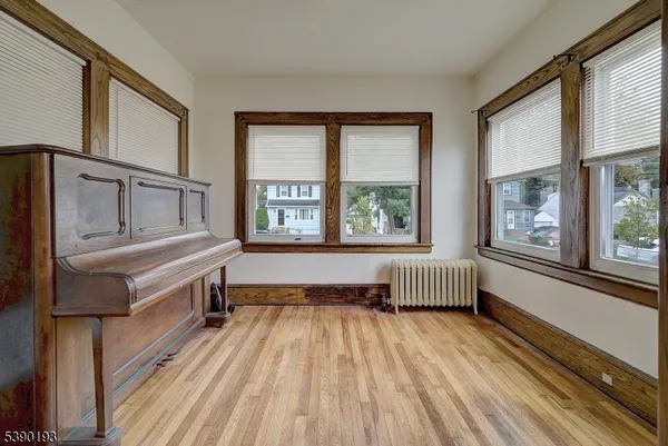 a spacious bathroom with a bathtub and windows