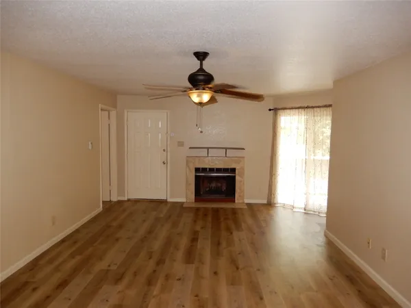 a bedroom with a bed and a fireplace
