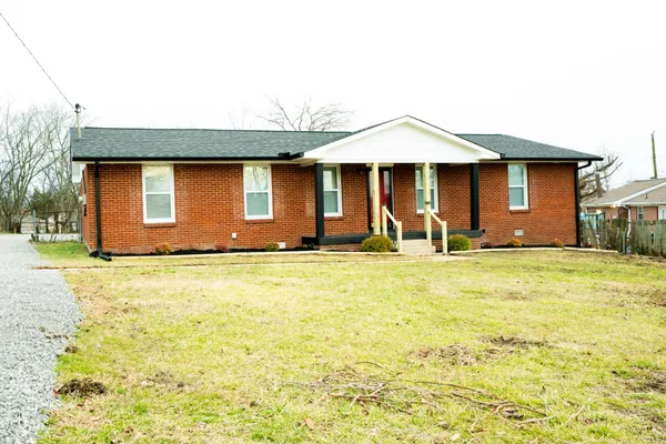 a front view of a house with yard