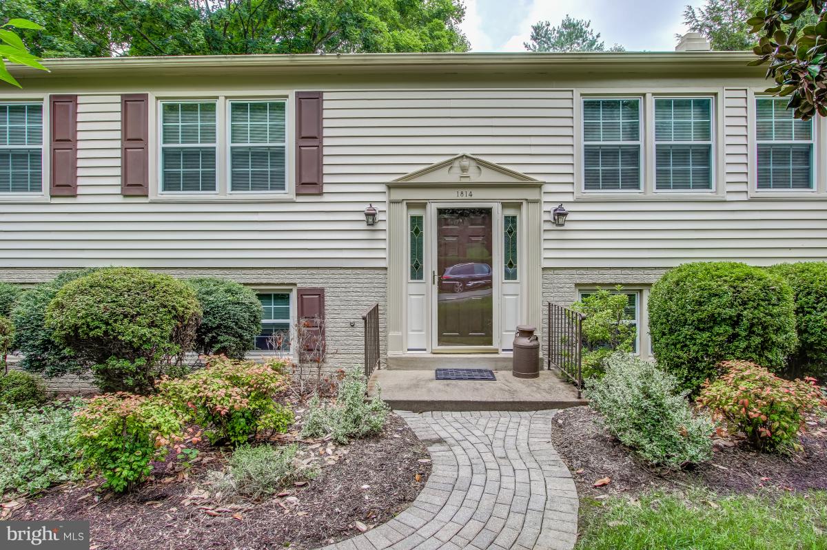1814 Cranberry Lane Reston, VA 20191 - Photo 1 of 30 a front view of a house with garden