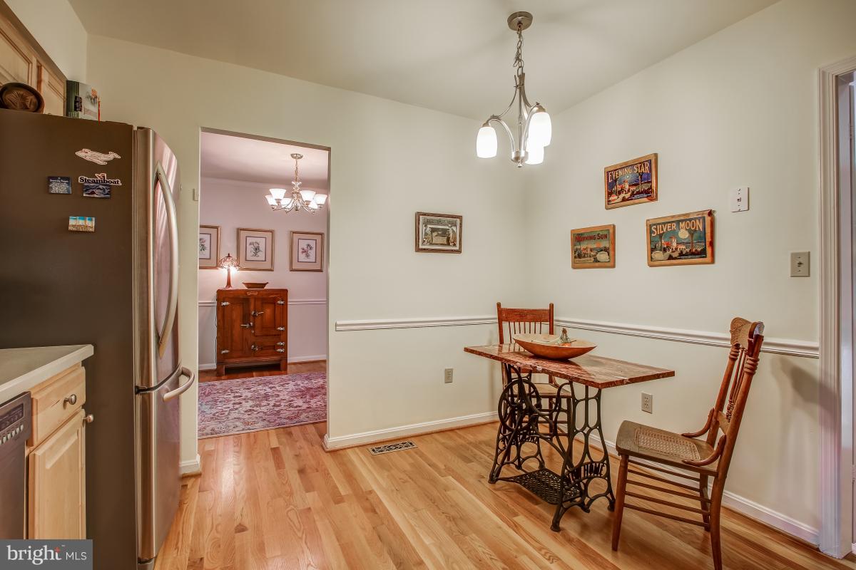 1814 Cranberry Lane Reston, VA 20191 - Photo 13 of 30 a view of a dining room with furniture and wooden floor