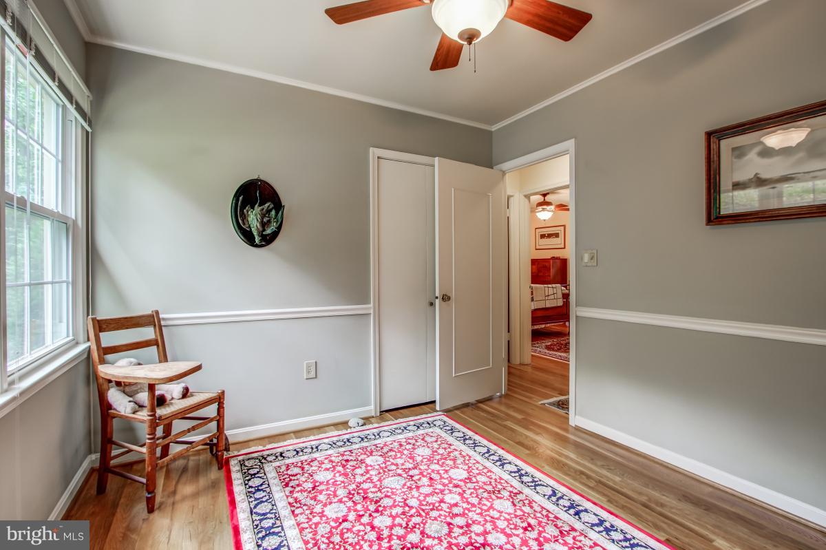 1814 Cranberry Lane Reston, VA 20191 - Photo 18 of 30 a view of a hallway with wooden floor and workspace