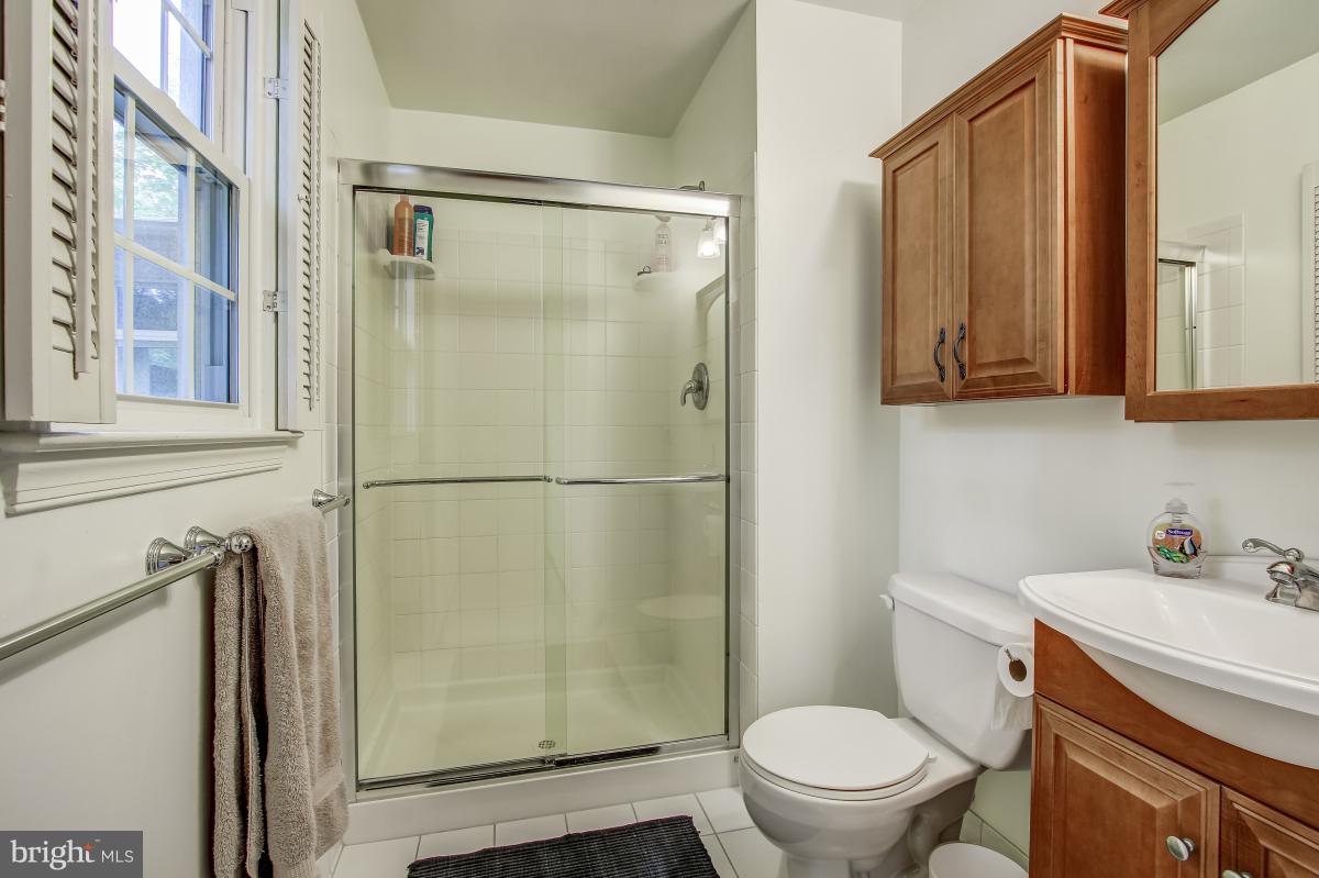 1814 Cranberry Lane Reston, VA 20191 - Photo 21 of 30 a bathroom with a shower a toilet and a sink
