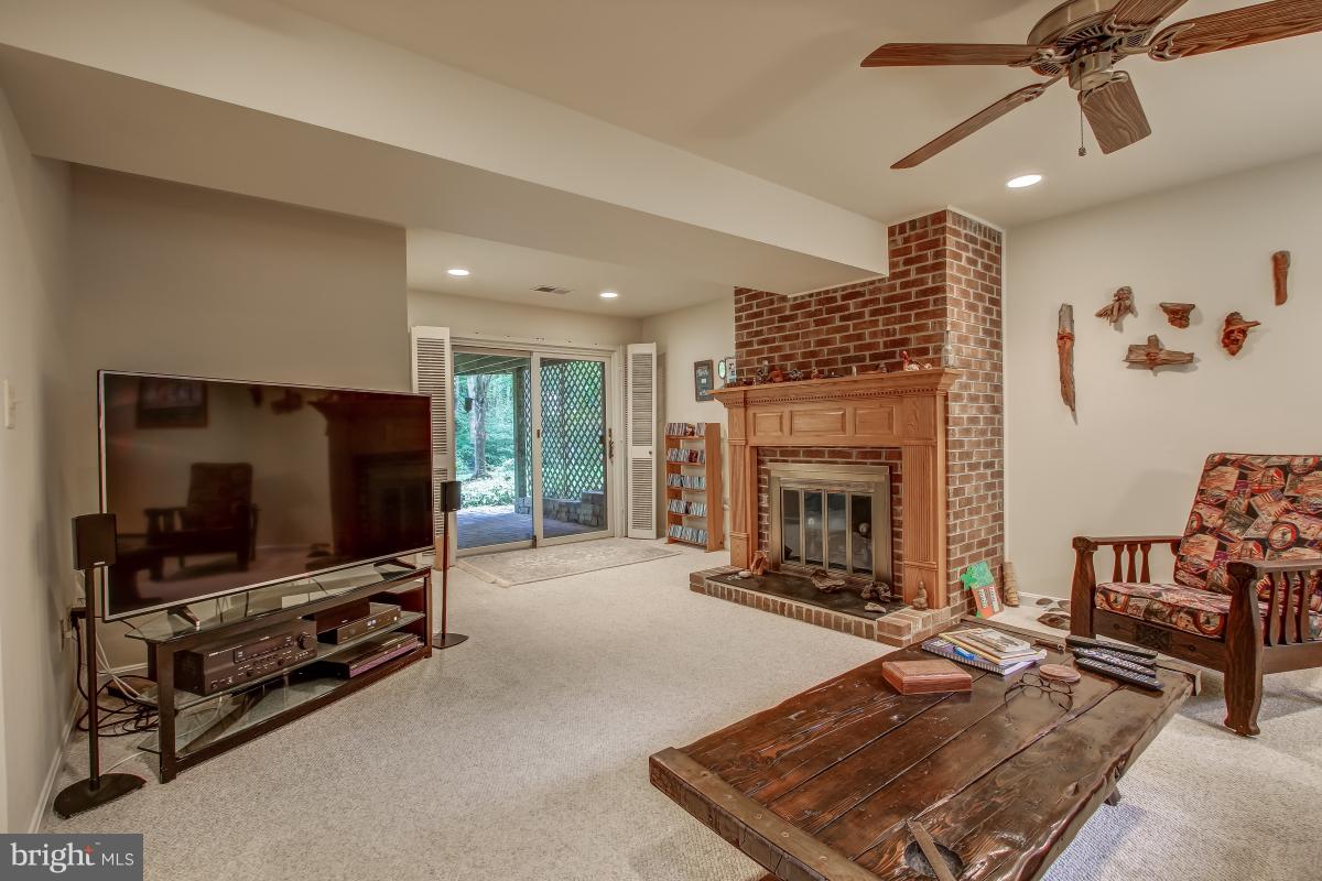 1814 Cranberry Lane Reston, VA 20191 - Photo 24 of 30 a living room with fireplace furniture and a flat screen tv