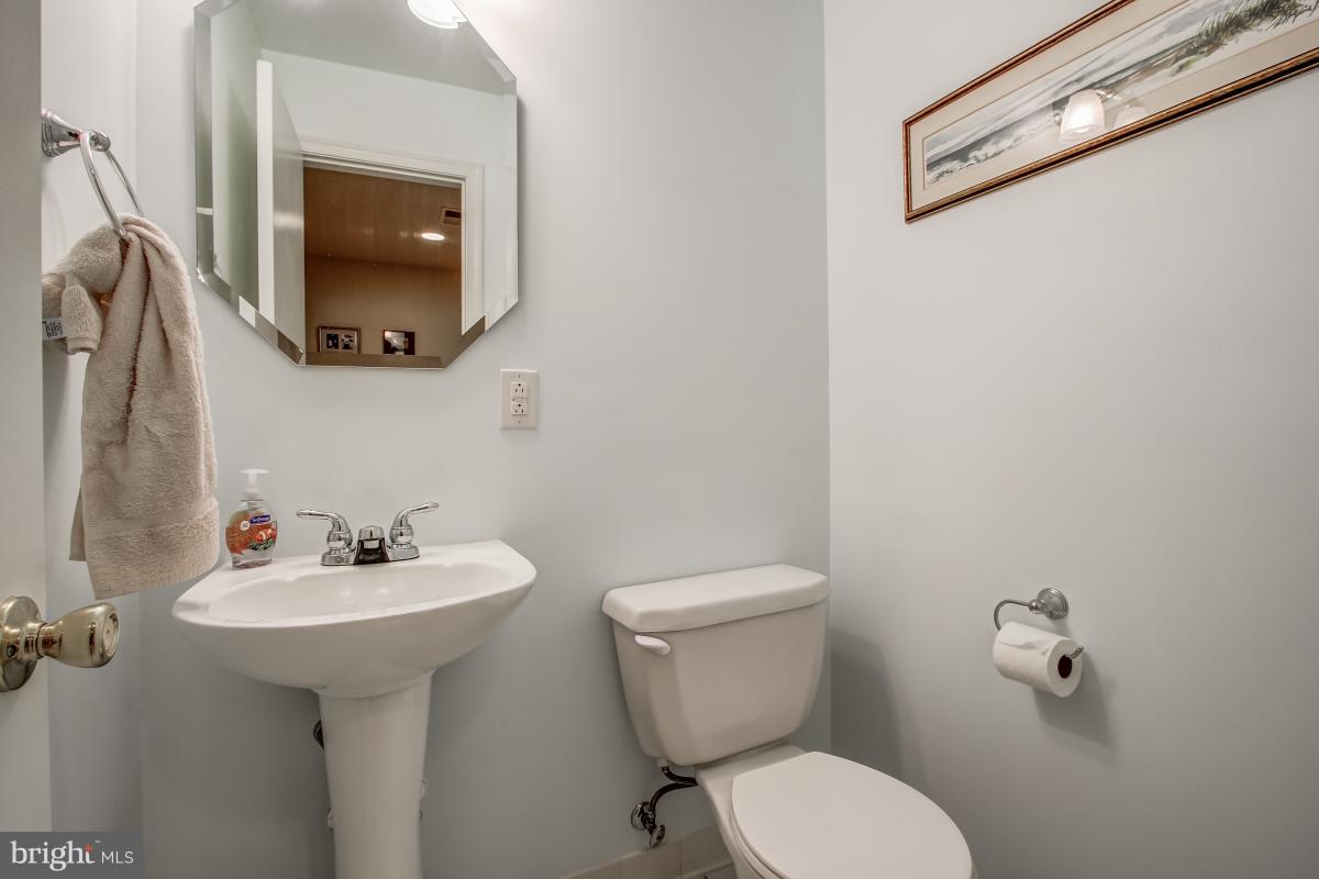 1814 Cranberry Lane Reston, VA 20191 - Photo 26 of 30 a bathroom with a toilet sink and mirror